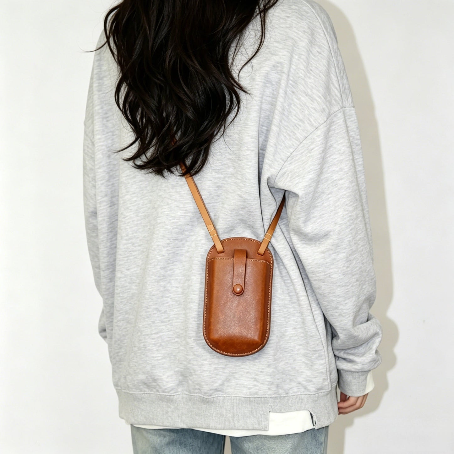 Handmade leather phone bag with shoulder strap